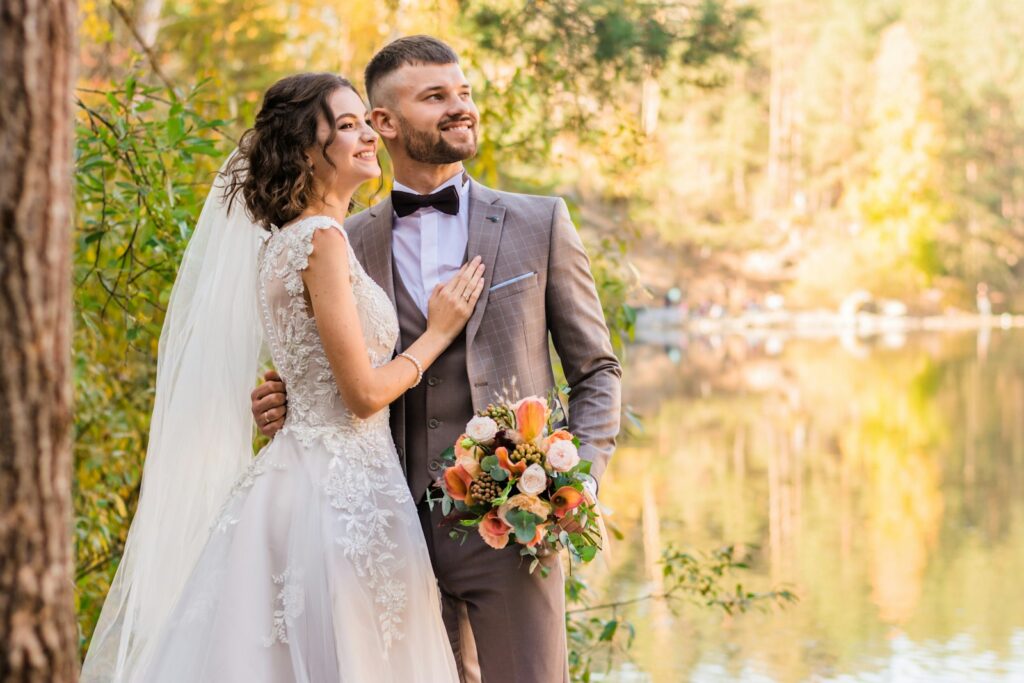 man in gray suit and woman in white wedding dress